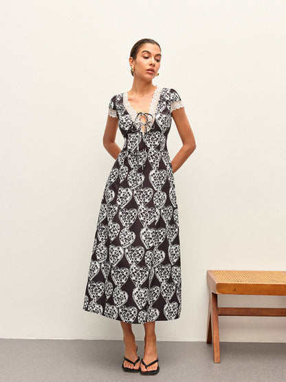 Çiçek Desenli V Yaka Fiyonk Bağlamalı Elbise