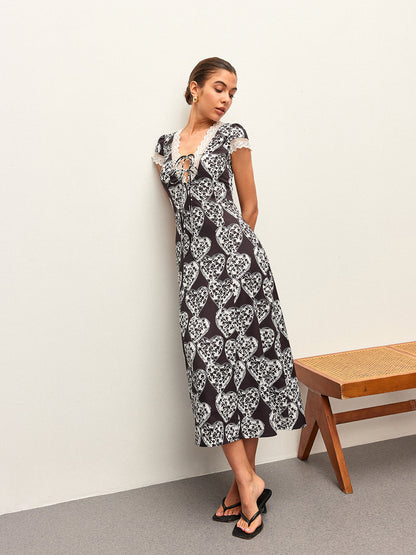 Çiçek Desenli V Yaka Fiyonk Bağlamalı Elbise